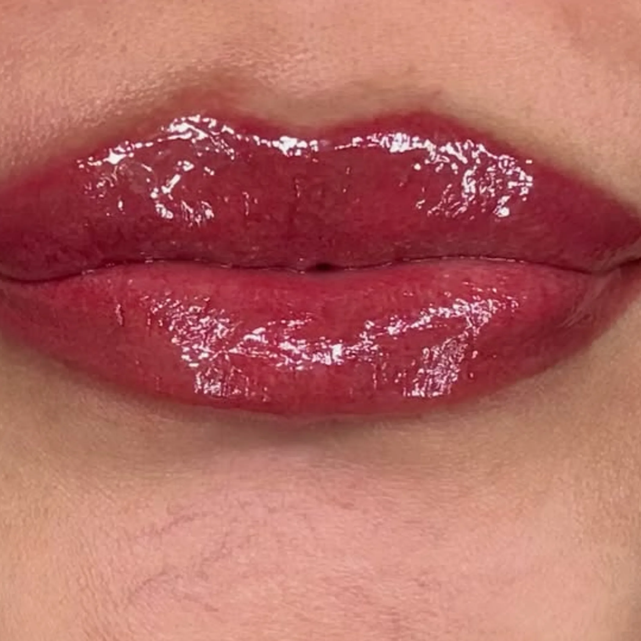 red lip tattooing close-up